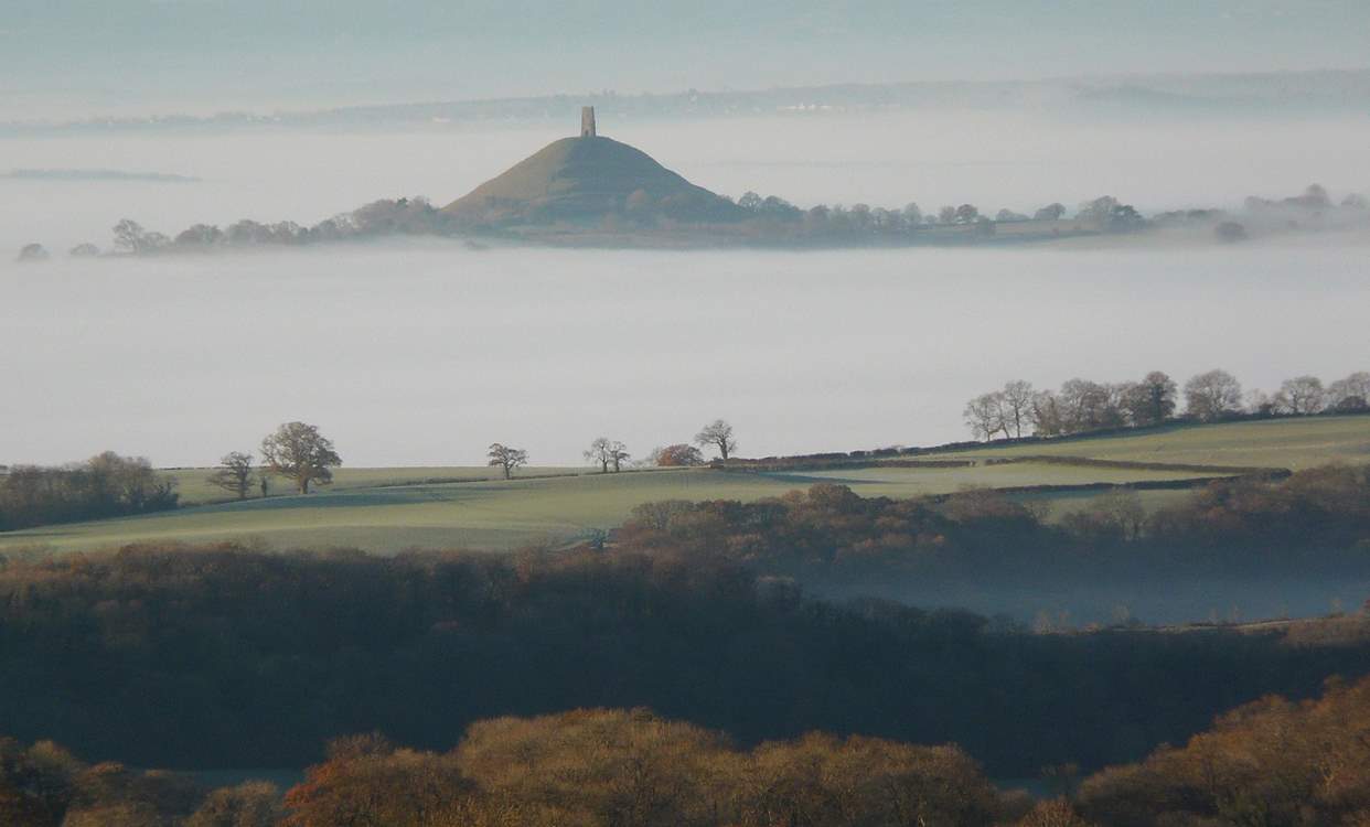 Why not visit iconic Glastonbury with is enchanting tor? The views from the top are simply spellbinding. 