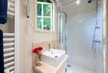 The en suite shower-room is beautifully fitted including a heated towel rail.
