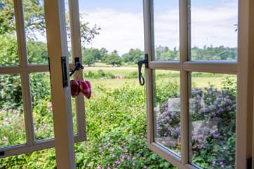 The view from your kitchen window across open fields which are grazed by cattle and sheep.