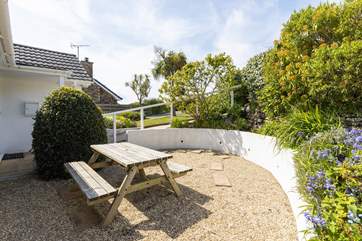 The front garden enjoys the afternoon and evening sun.
