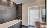 Light pours in to this gorgeous en suite bathroom (Bedroom 1). - Thumbnail Image