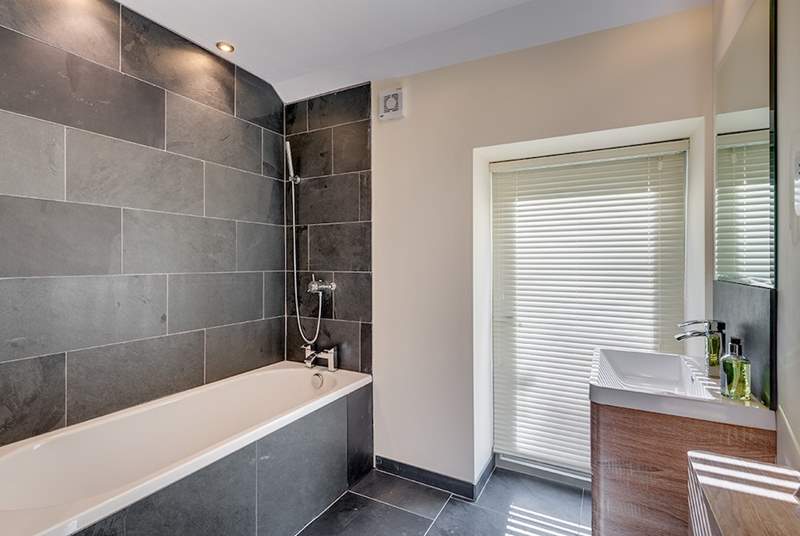 Light pours in to this gorgeous en suite bathroom (Bedroom 1).