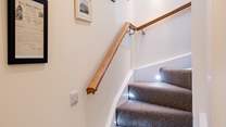 The stairs snaking up to the first floor.