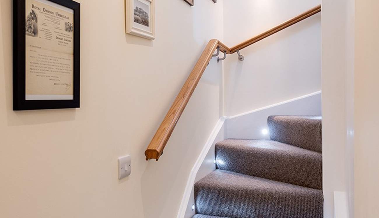 The stairs snaking up to the first floor.