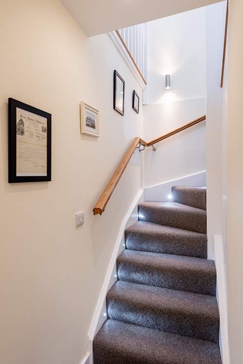 The stairs snaking up to the first floor.