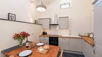 Open plan kitchen and dining area makes serving up a feast for two a real pleasure.
