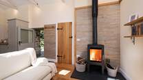 The glowing wood-burner makes snuggling up and relaxing a real pleasure.