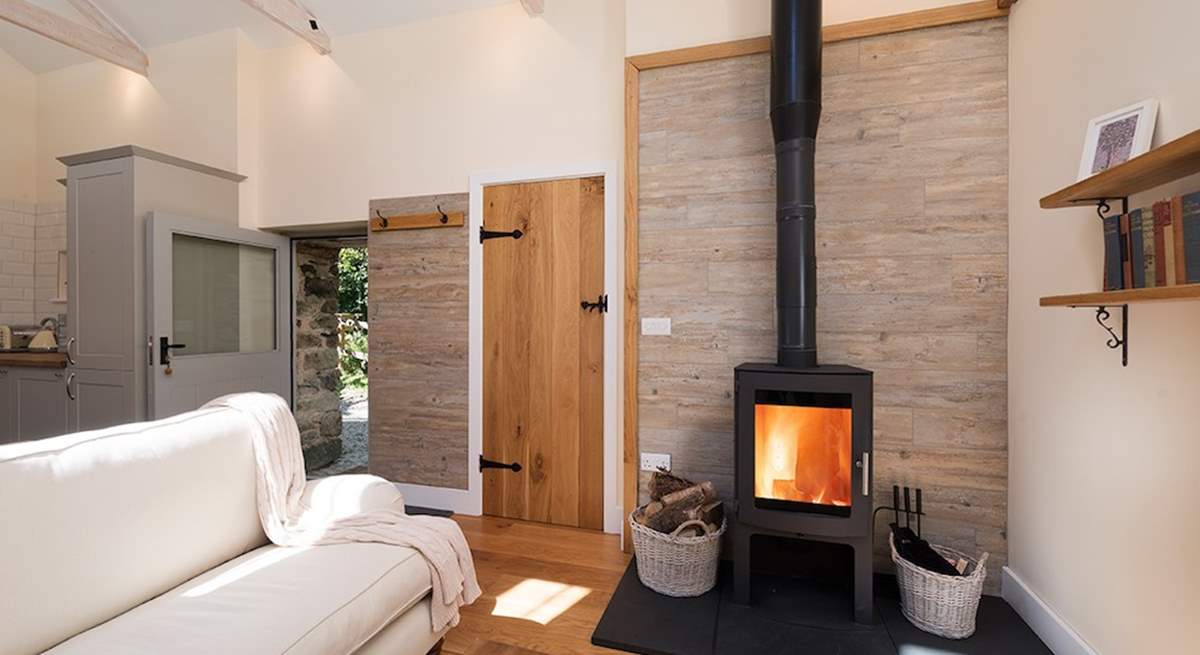 The glowing wood-burner makes snuggling up and relaxing a real pleasure.