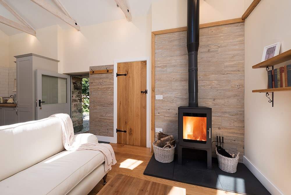 The glowing wood-burner makes snuggling up and relaxing a real pleasure.