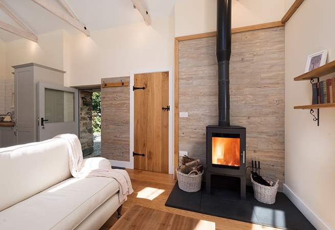 The glowing wood burner makes snuggling up and relaxing a real pleasure.