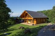 Coombe Lodge is a stunning, spacious Scandinavian style lodge with a large level garden, hot tub and sauna!