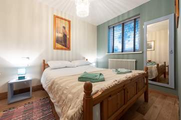 The bedroom has a king size double bed.