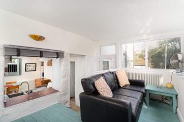 The sun-room is a lovely space to relax throughout the year.