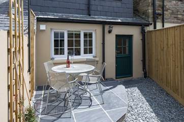 The sunny sheltered patio at the rear of the cottage.