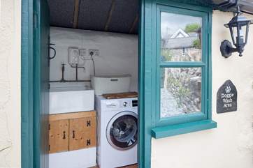 The outside utility-room even has a dog washing hose to help with muddy paws.