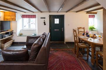 Looking towards the front door in the sitting/dining-room.
