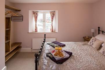 The master bedroom (bedroom 1) has a double bed and pretty furnishings.