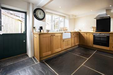 The kitchen benits from a stable door.