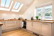 The stylishly fitted kitchen is very well-equipped and has wonderful views.