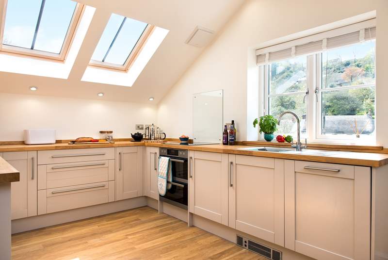 The stylishly fitted kitchen is very well-equipped and has wonderful views.