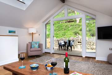 The double doors lead out to the decking-area.