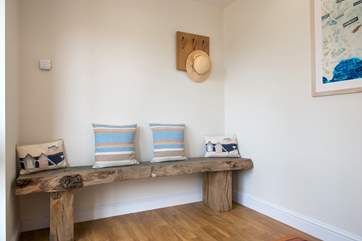 A lovely wooden bench in the hallway.