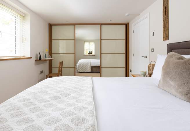 The main bedroom has a sumptuous king size bed.