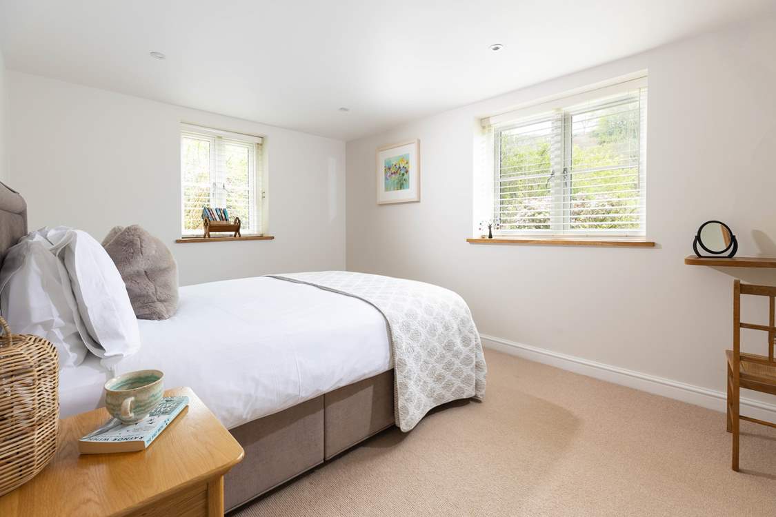 The main bedroom has a lovely view out over the countryside.