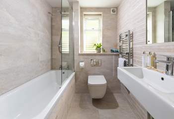 The family bathroom is light and bright. 