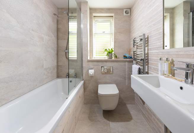 The family bathroom is light and bright. 