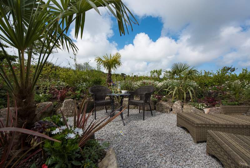 With its fabulous sheltered 'tropical' patio-area.