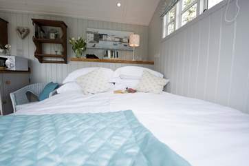 There is a gorgeous king-size bed.
