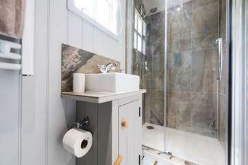 There is a wash-basin and proper flushing toilet too.