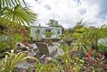 The Shepherd's Hut at Georgia Bridge sitting in its tropical oasis!