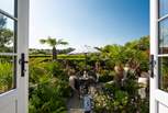 The double patio doors lead to your very own tropical paradise.