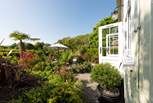 The outside space of dreams, surrounded by beautiful flowers, plants and trees. 