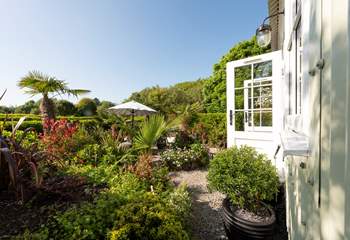 The outside space of dreams, surrounded by beautiful flowers, plants and trees. 