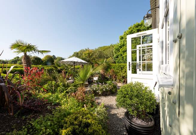 The outside space of dreams, surrounded by beautiful flowers, plants and trees. 