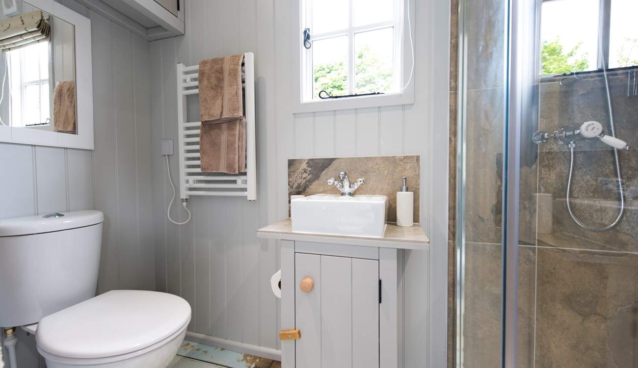 The beautiful bathroom sits at the end of the hut.