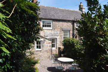 The back of the property and the gravelled courtyard.