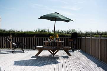An umbrella is provided for shade, if needed,