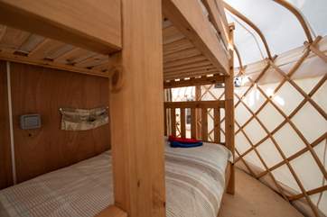 A beautifully handcrafted door leads through to 'Little' Rosewood with its bunk-room (full size bunk-beds) and through to the bathroom.