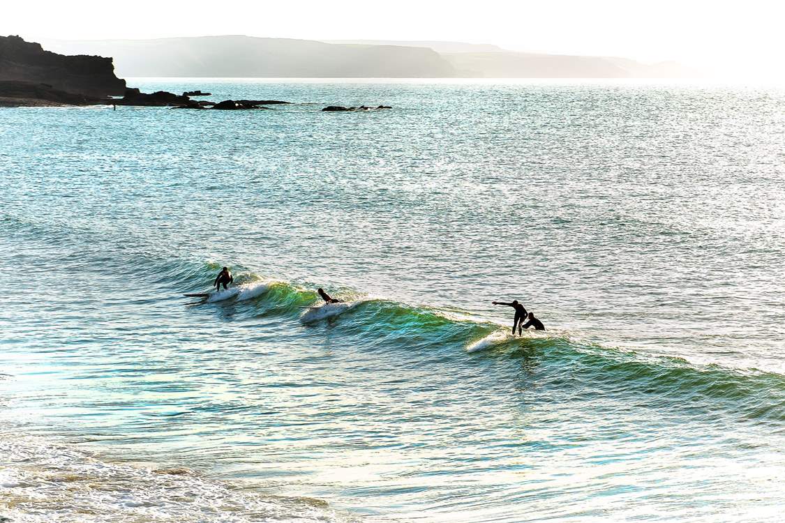 Head to the coast to watch the surfers enjoying the waves.