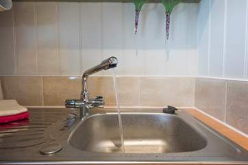 A little kitchen-area with hot and cold water to your kitchen sink.
