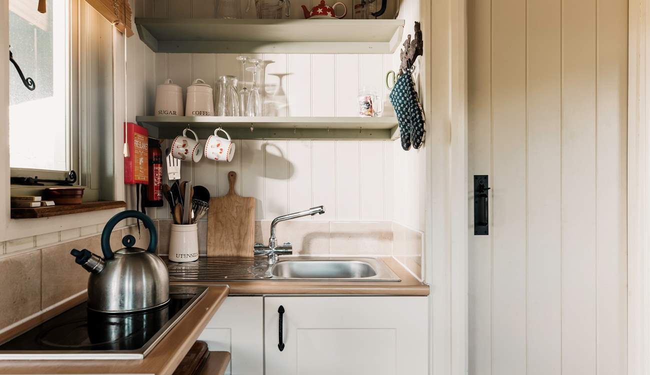 The small kitchen area is perfectly equipped for two.