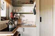 The small kitchen area is perfectly equipped for two.