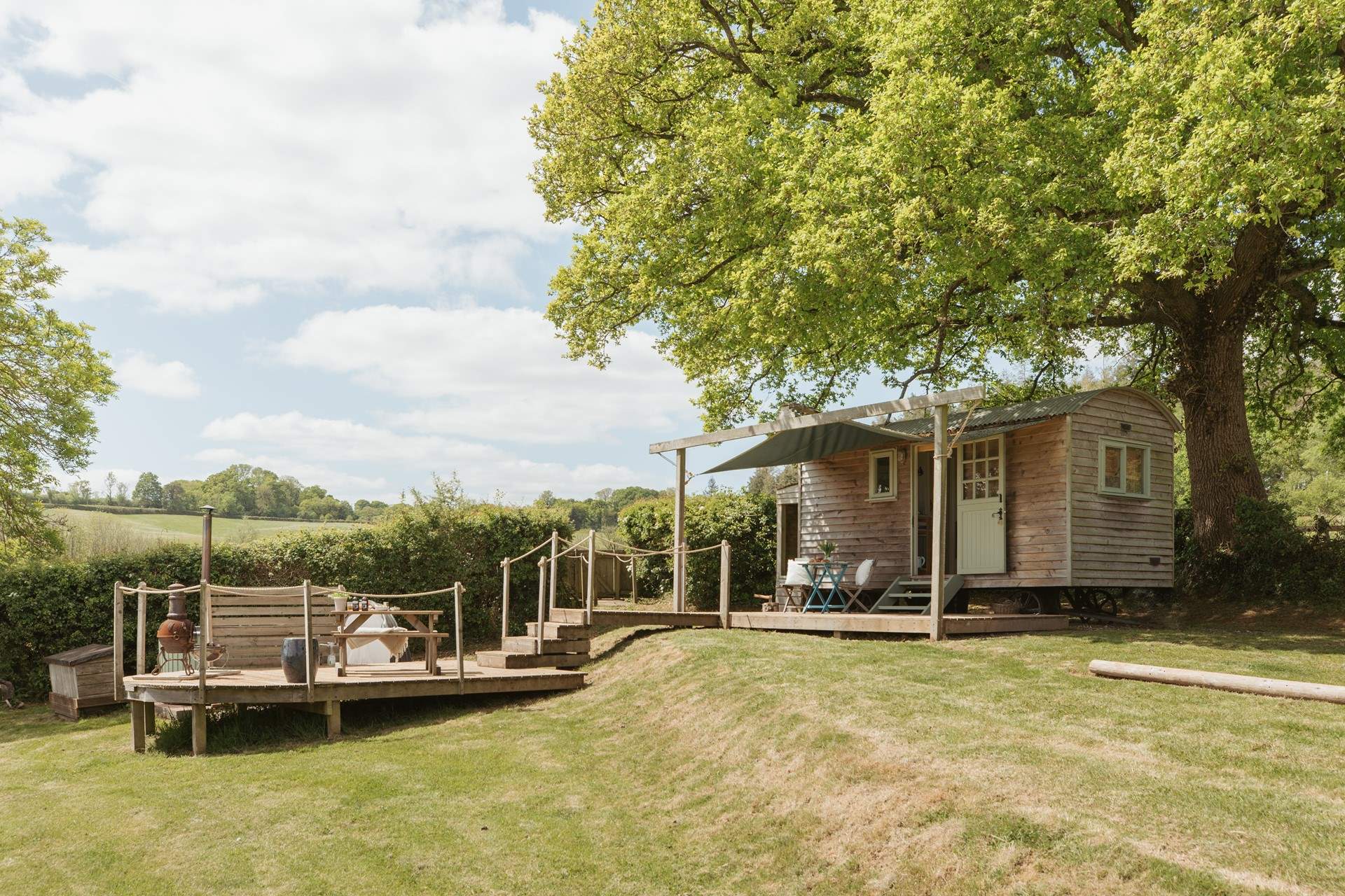 Nestled beneath an ancient oak tree, the setting is simply enchanting. 