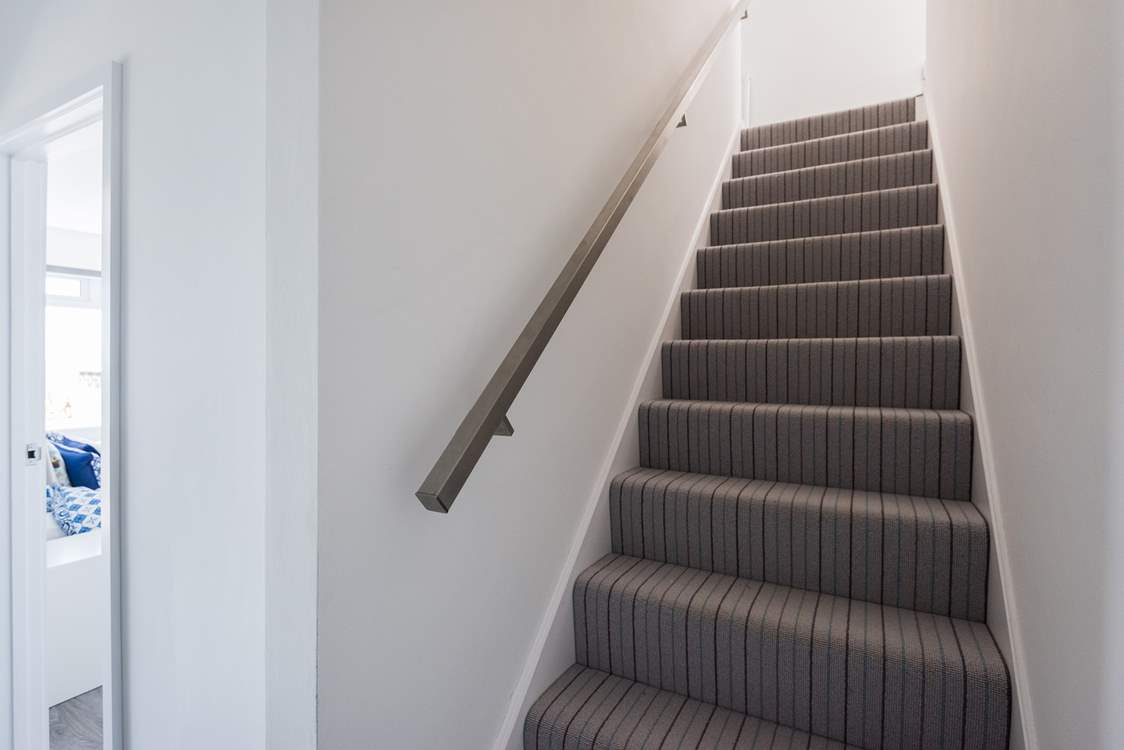 The stairs down to the lower ground floor where you will find the main bedroom, study and bathroom and access out onto the garden.