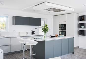 The stylishly cool and funky kitchen where you can change the colour of the lights above the island to suit your mood.