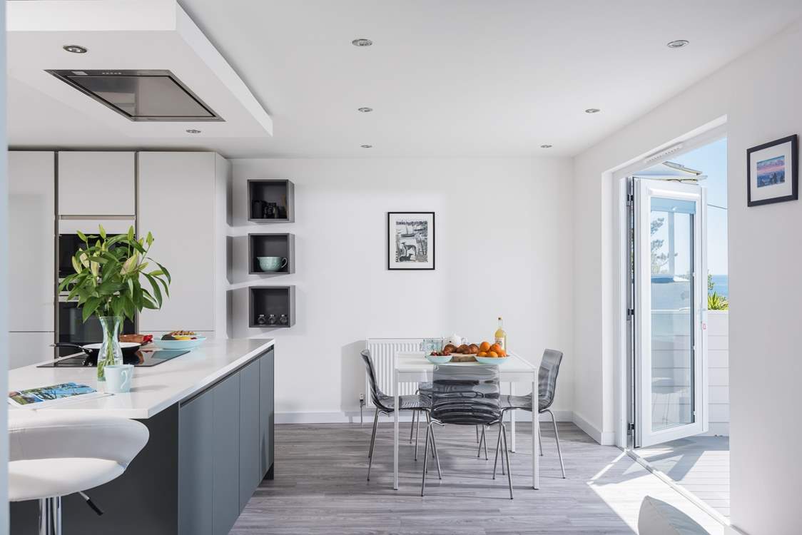 There is room to dine in the kitchen or you can move the table out onto the fabulous deck.